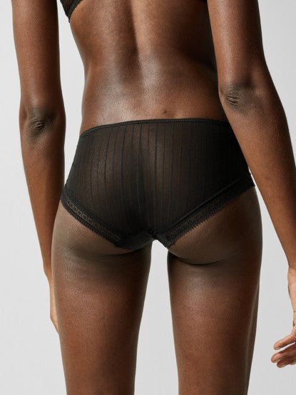 Back view of Maddie Shorty Brief in black, showcasing sheer lace and soft tulle with a flattering, cheeky cut.