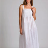 Model wearing Hailspot Sleeveless Pintuck Nightie in white, featuring hail spot cotton texture, pintuck detail, and lace-trimmed square neckline.