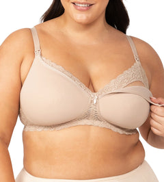 Model wearing Gorgeous Mama Maternity Bra in Nude with one cup unclipped to show drop-down nursing feature.