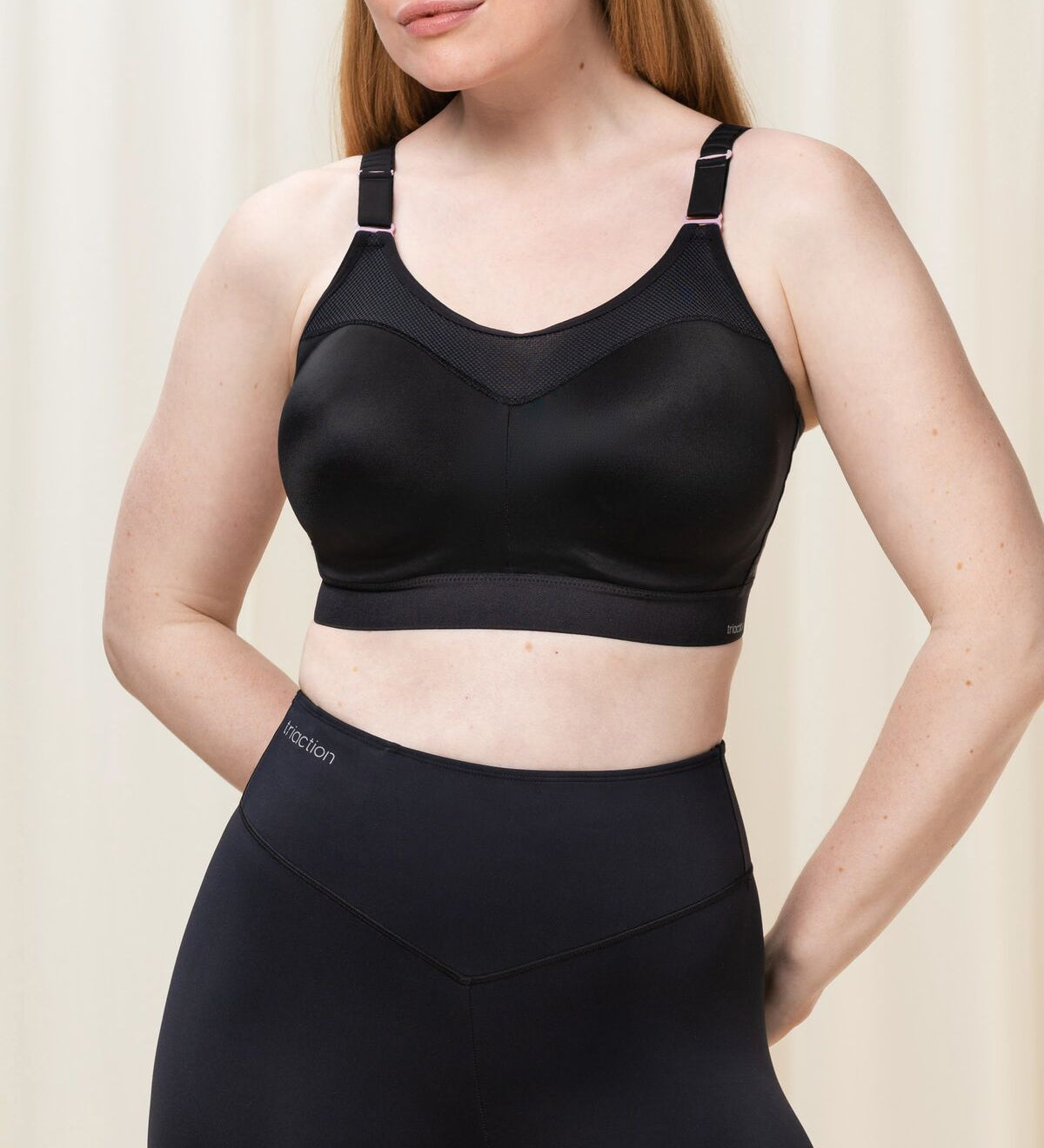 Front view of Triumph Triaction Control Lite Black sports bra from The Foundation, showing comfortable minimiser fit and wide straps