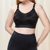 Front view of Triumph Triaction Control Lite Black sports bra from The Foundation, showing comfortable minimiser fit and wide straps