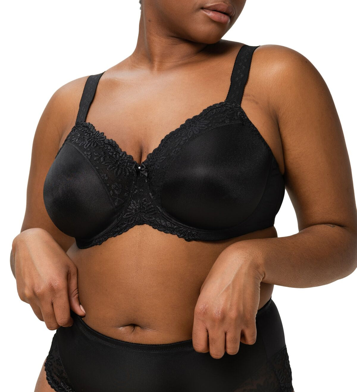 Front view of model wearing Ladyform Soft WX Bra Black by Triumph, showing full coverage and lace trim minimiser design