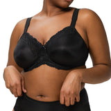 Front view of model wearing Ladyform Soft WX Bra Black by Triumph, showing full coverage and lace trim minimiser design