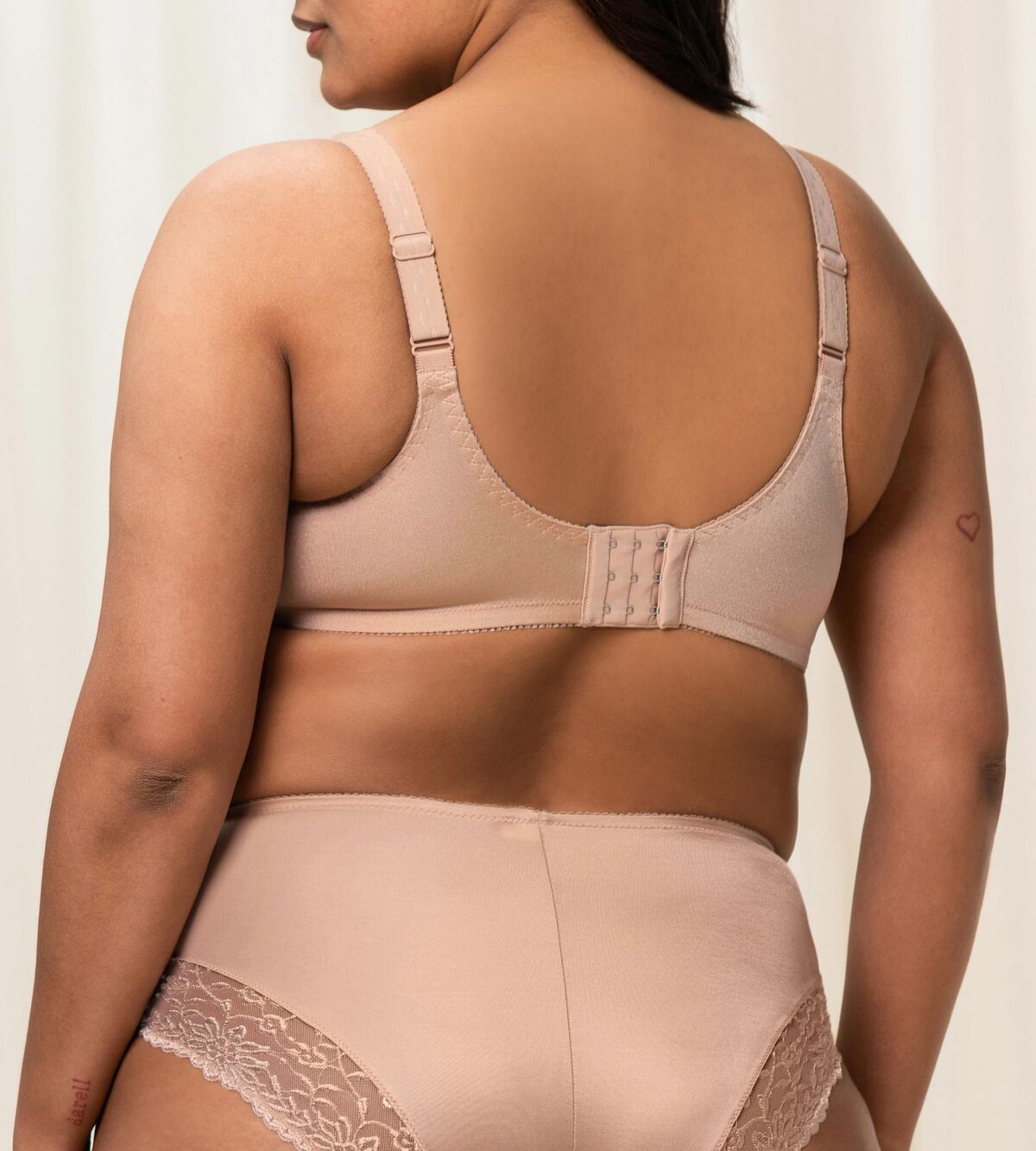 “Back view of the Triumph Ladyform Soft WX Bra in Smooth Skin, featuring adjustable straps and smooth back support.