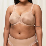 Plus-size model wearing the Triumph Ladyform Soft WX Bra in Smooth Skin , showing supportive fit and comfortable lace design.