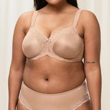 Plus-size model wearing the Triumph Ladyform Soft WX Bra in Smooth Skin , showing supportive fit and comfortable lace design.