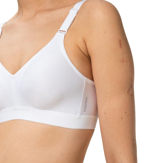 Close-up side angle of the Triaction Wellness Bra in White by Triumph, showing smooth fit and breathable stretch—available now at The Foundation.