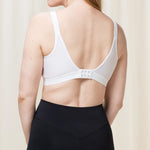 Back view of the Triaction Wellness Bra by Triumph in White with adjustable straps and active fit—shop at The Foundation.