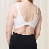 Back view of the Triaction Wellness Bra by Triumph in White with adjustable straps and active fit—shop at The Foundation.
