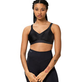 Model wearing full Triaction Wellness set in Black by Triumph, perfect for yoga or pilates—exclusive to The Foundation.