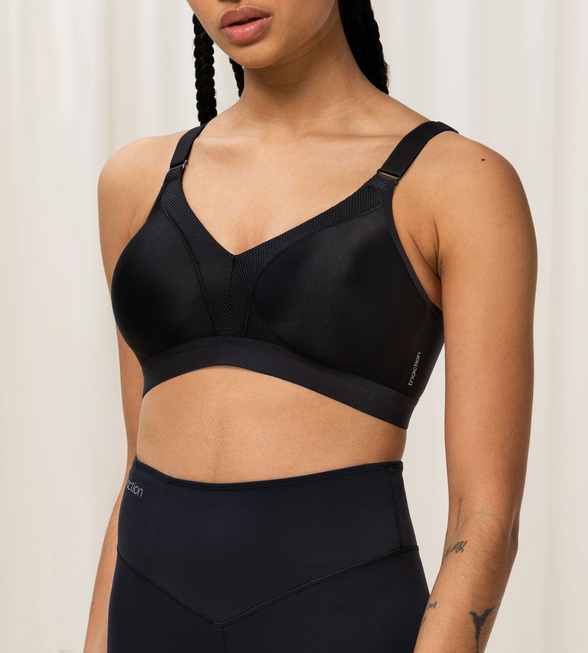 Front view of Triumph Triaction Wellness Bra in Black, wire-free with mesh-lined cups—designed for low-intensity workouts at The Foundation.