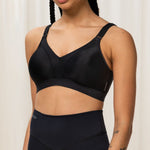 Front view of Triumph Triaction Wellness Bra in Black, wire-free with mesh-lined cups—designed for low-intensity workouts at The Foundation.