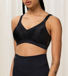 Front view of Triumph Triaction Wellness Bra in Black, wire-free with mesh-lined cups—designed for low-intensity workouts at The Foundation.