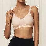 Front view of Triaction Wellness wire-free bra in Neutral Beige, showing soft contoured fit for gentle support.