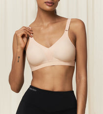 Front view of Triaction Wellness wire-free bra in Neutral Beige, showing soft contoured fit for gentle support.