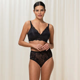 The Foundation’s Amourette Charm Non Wire Moulded Bra Black styled with matching briefs on model, perfect for everyday comfort.