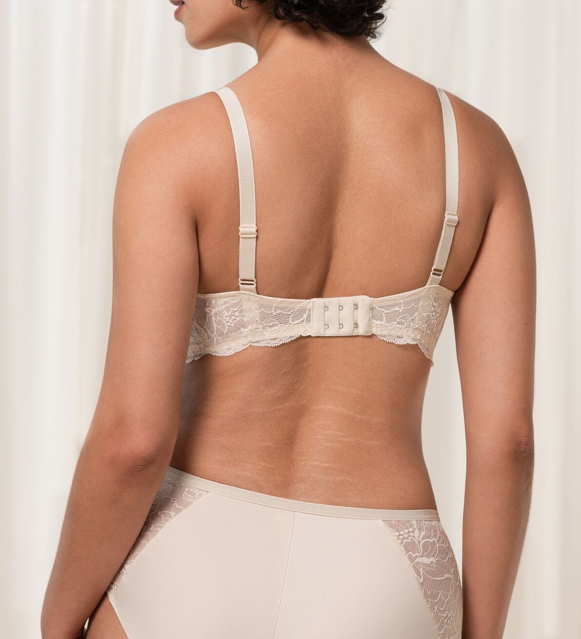 Back image of The Foundation’s Creamy Dream Amourette Charm Bra, featuring adjustable straps and lace panel band.