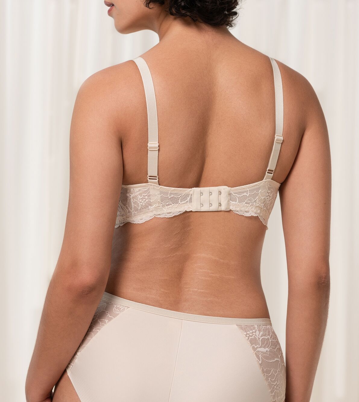 Back image of The Foundation’s Creamy Dream Amourette Charm Bra, featuring adjustable straps and lace panel band.