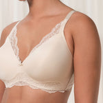 Close up of The Foundation’s Amourette Charm Non Wire Bra in Creamy Dream, showing lace-trimmed cups and soft padded design.