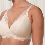 Close up of The Foundation’s Amourette Charm Non Wire Bra in Creamy Dream, showing lace-trimmed cups and soft padded design.