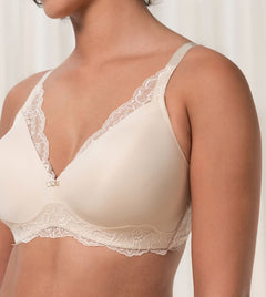 Close up of The Foundation’s Amourette Charm Non Wire Bra in Creamy Dream, showing lace-trimmed cups and soft padded design.