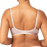 Back view of Triumph’s Sheer Minimiser Bra in nude pink, showing wide band and adjustable straps—available now at The Foundation.