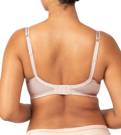 Back view of Triumph’s Sheer Minimiser Bra in nude pink, showing wide band and adjustable straps—available now at The Foundation.