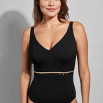 Front view of Model posing in the black Empreinte Cosmic swimsuit, showcasing the elegant V-neckline and smoothing silhouette.