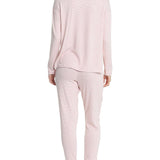 Back view of the long sleeve top and joggers set, showcasing fit and pink striped fabric texture.