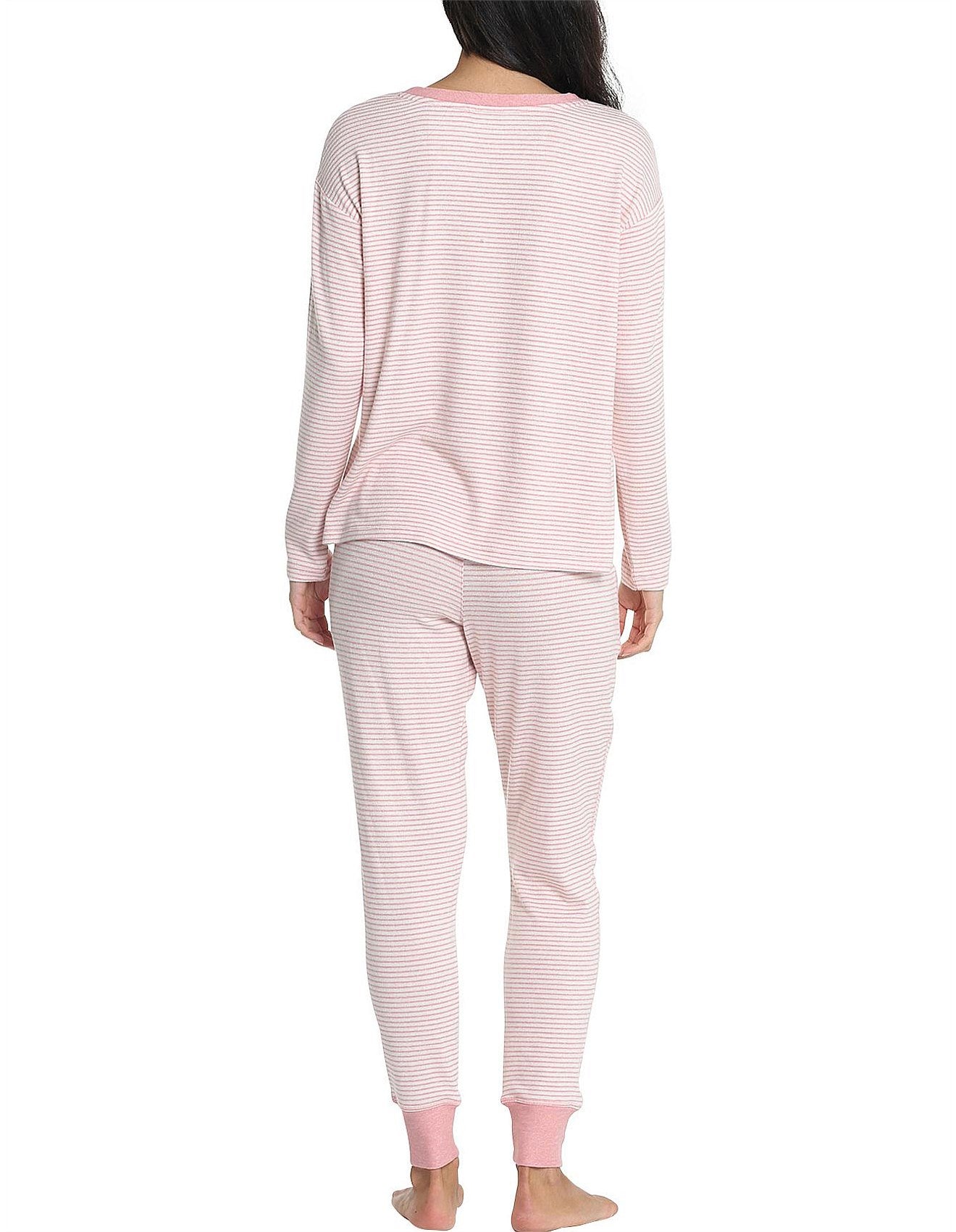 Back view of the long sleeve top and joggers set, showcasing fit and pink striped fabric texture.