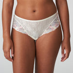 Front view of Prima Donna Mohala Luxury Thong Brief Vintage Natural on model showing soft pastel floral embroidery and lace fabric.