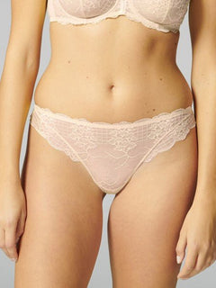 Front view of Reve Tanga Thong Brief Sakura Pink from The Foundation – delicate scalloped lace design with soft waistband.