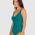 Side view of Baku’s Rococco Ring Front One Piece in Jungle green, showing curve-hugging fit and soft-edge design at The Foundation.