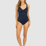 Model wearing Baku Rococco Ring Front Swimsuit in deep navy Nightfall shade, with shaping panels and elegant design, found at The Foundation.