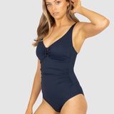 Side view of the Rococco One Piece in Nightfall navy by Baku, showing tortoise shell ring detail and soft structure, stocked at The Foundation.