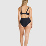 Back view of model in Baku Rococco EFG Cup Bra Nero and matching bottoms, highlighting convertible straps and supportive design.