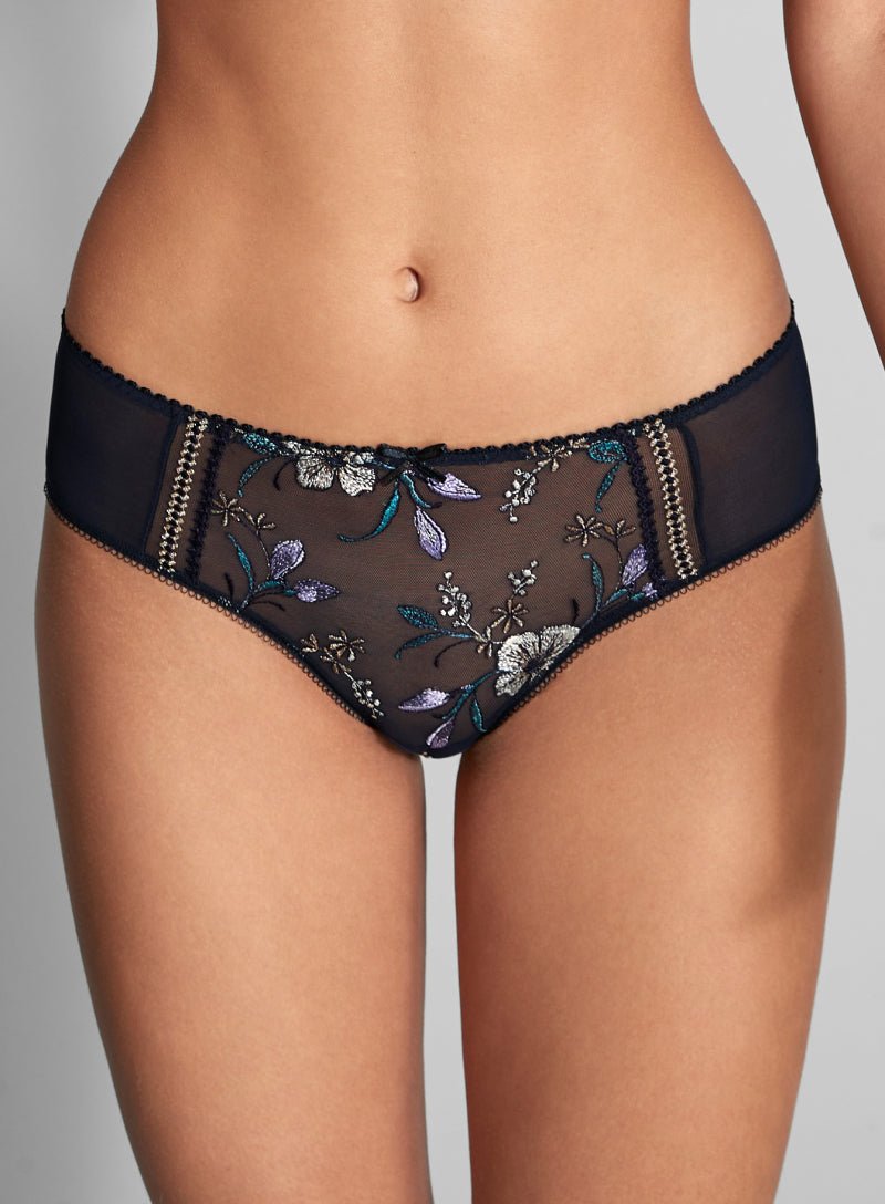 Close up of Empreinte Lauren Shorty Brief Night Magic on model featuring floral embroidery and decorative stitching.