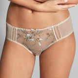 Close up of Empreinte Lauren Shorty Brief Or Ancien Ivory on model showing delicate embroidery and seamless fit