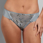 Close-up of the Empreinte Lauren Thong Brief in Sky Blue, showcasing shimmering floral embroidery and satin bows.