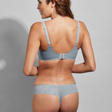 Model showing the back of the Lauren Thong Brief in Sky Blue, highlighting sleek fit and delicate details.