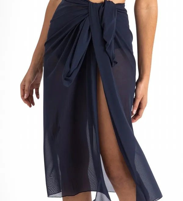 Close-up of Cosmopolitan Classic Mesh Sarong Ink tied at the waist, Jantzen at The Foundation, showing shaped tie ends and mesh fabric.