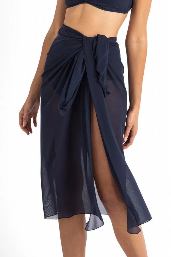 Close-up of Cosmopolitan Classic Mesh Sarong Ink tied at the waist, Jantzen at The Foundation, showing shaped tie ends and mesh fabric.
