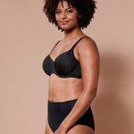 Virginia Spacer Bra in Black shown on model, featuring seamless cups and supportive spacer fabric.