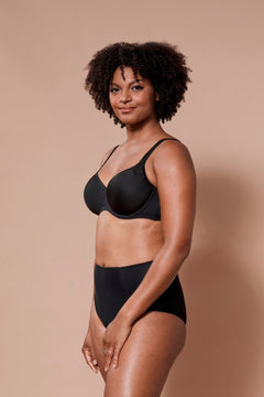Virginia Spacer Bra in Black shown on model, featuring seamless cups and supportive spacer fabric.
