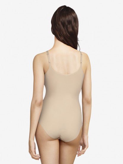 Back view of Soft Stretch Bodysuit Nude on model, from The Foundation, highlighting seamless design and adjustable straps for all-day comfort.