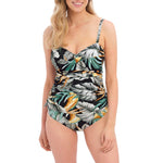 Model wearing Bamboo Grove Underwire Twist Front Tankini Jet by Fantasie, available at The Foundation, showing flattering botanical print swimwear.