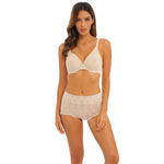 Model wearing Wacoal Halo Lace Full Brief in Nude, featuring soft floral lace and full coverage from The Foundation
