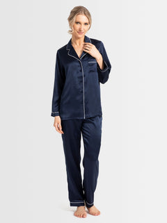 Model wearing Park Avenue Silk Pyjama Set in navy with ivory piping, standing front-facing.