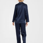 Back view of Park Avenue navy silk pyjamas highlighting contrast piping and relaxed fit.
