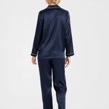 Back view of Park Avenue navy silk pyjamas highlighting contrast piping and relaxed fit.